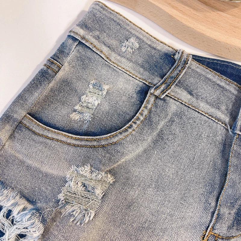 Microshorts vaqueros deshilachado a la moda