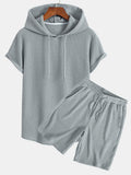 Conjunto de camiseta con capucha de tejido gofrado y bajo curvado, con pantalones cortos a juego y cordón ajustable
